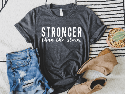 Stronger Than The Storm in White Inspirational Graphic Tee